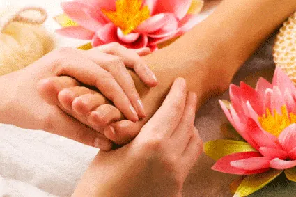 Reflexology on the hand, with lotus flowers